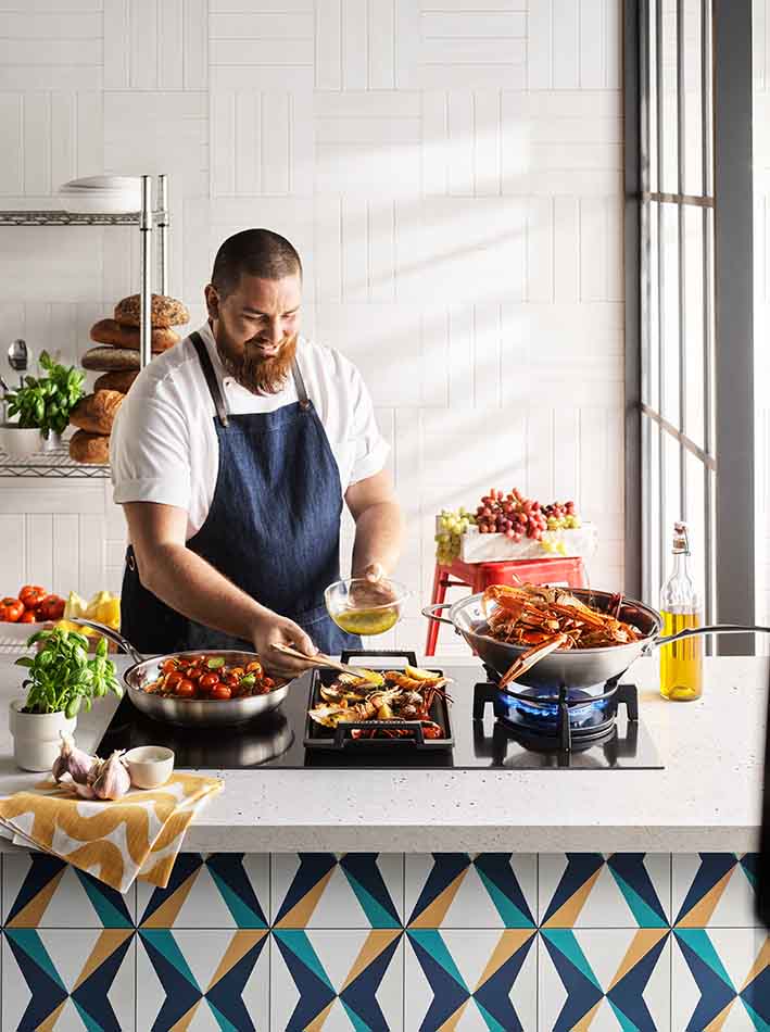Alex Prichard cooking using produce from the Produce Awards.