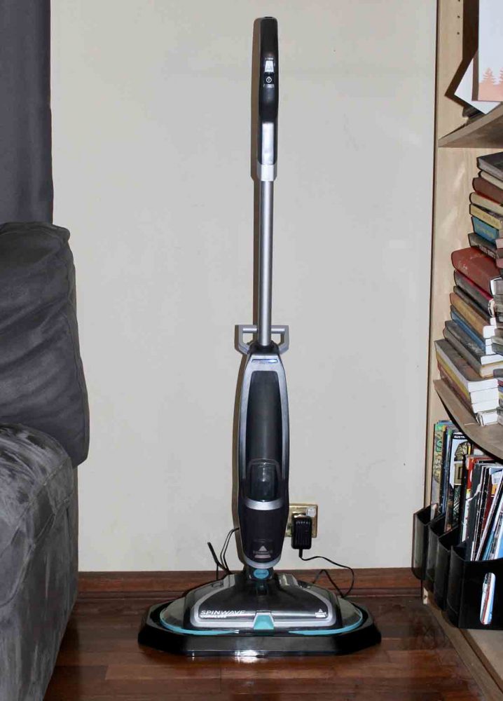 The Bissell SpinWave Cordless Mop plugged in and charging.