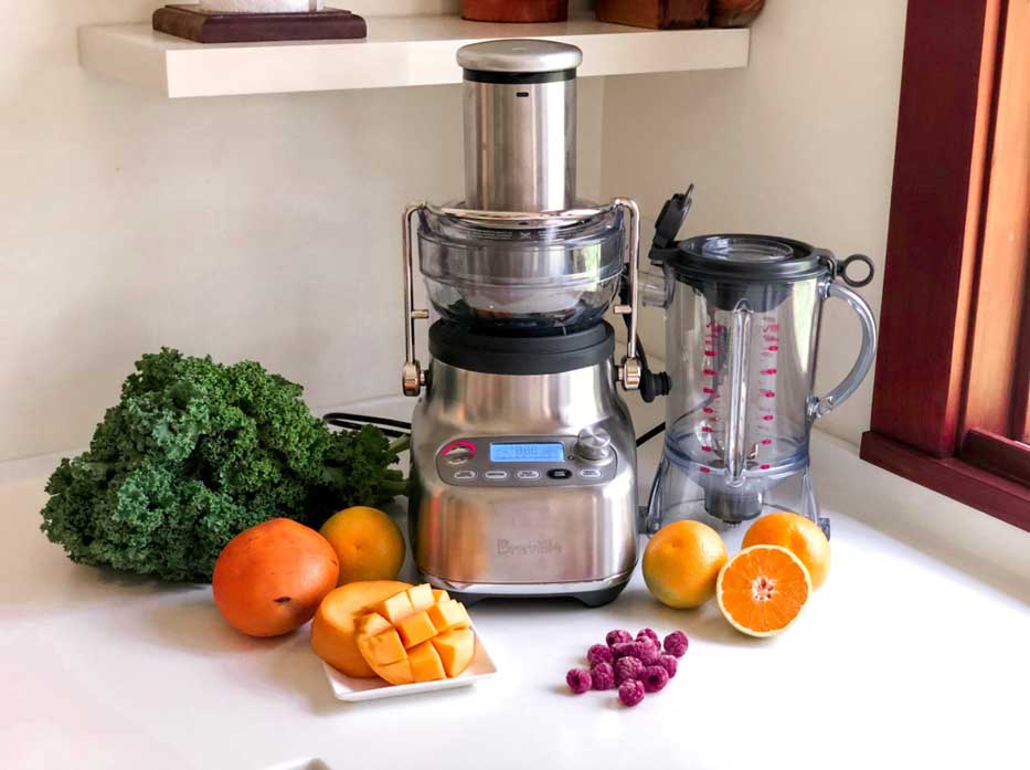 Breville the 3X Bluicer Pro pictured with ingredients for a green smothie recipe.