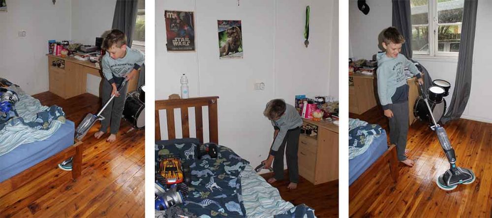 Our reviewer's son cleaning his bedroom with the Bissell SpinWave Cordless Mop.