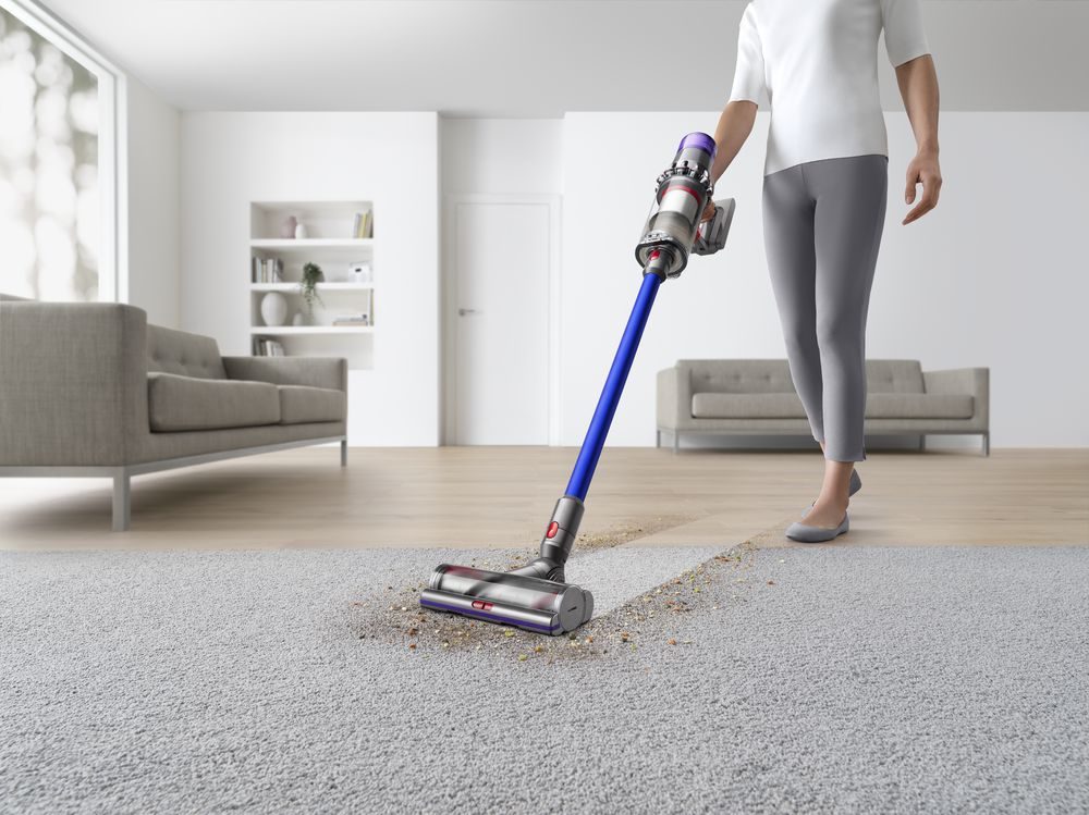 The Dyson V11 Absolute Cordless Vacuum Cleaner cleaning carpet.