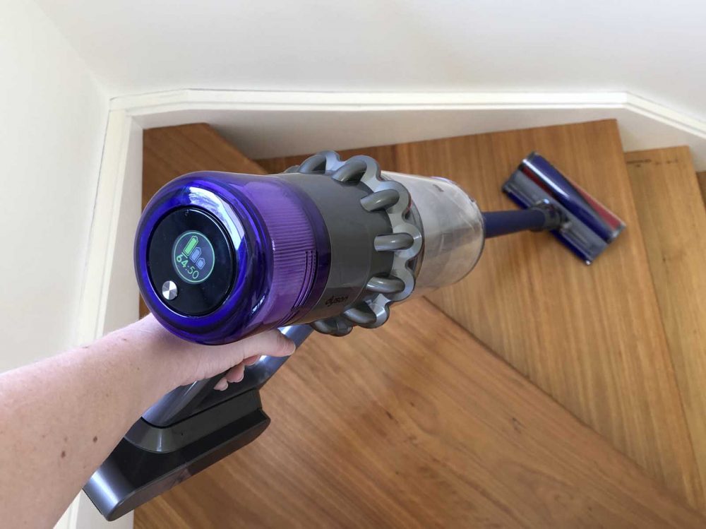 The Dyson V!11 Absolute vacuuming stairs.