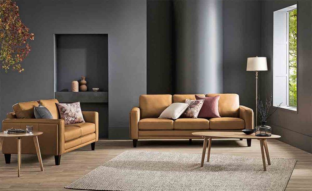 A dark wall behind the Florence 3-Seater Leather Sofa.