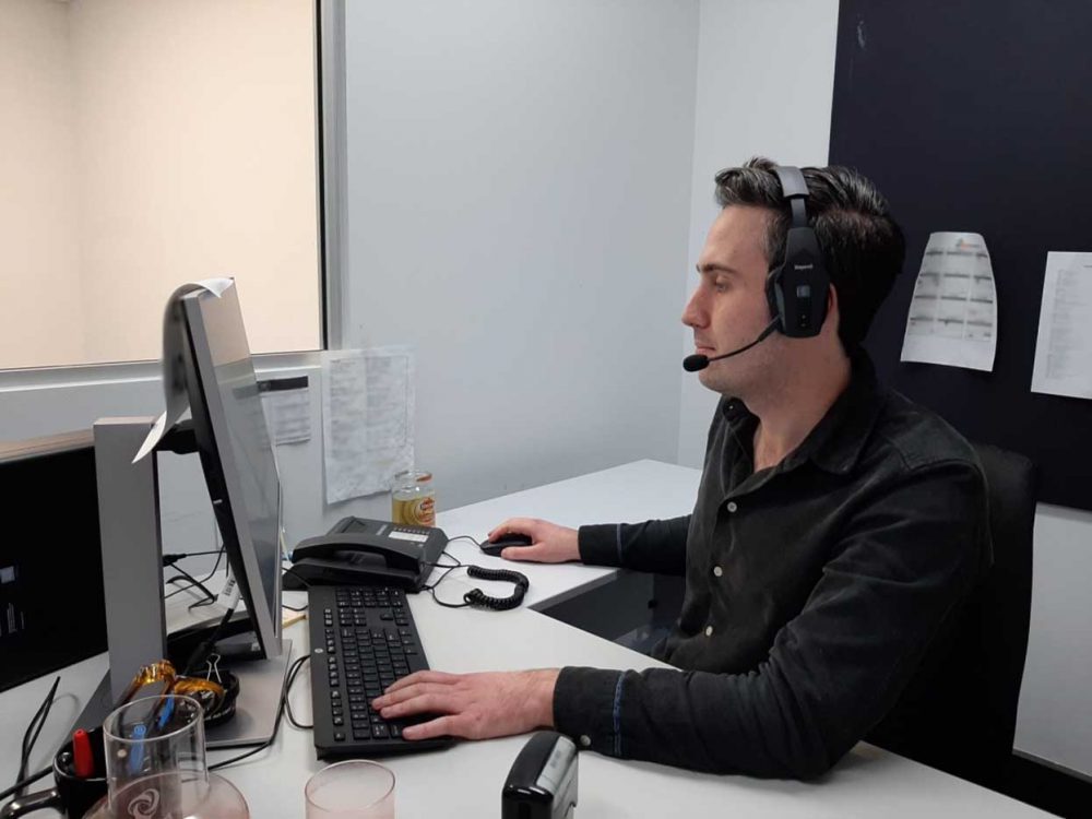 Our reviewer wearing a BlueParrott B550-XT Headset at work.