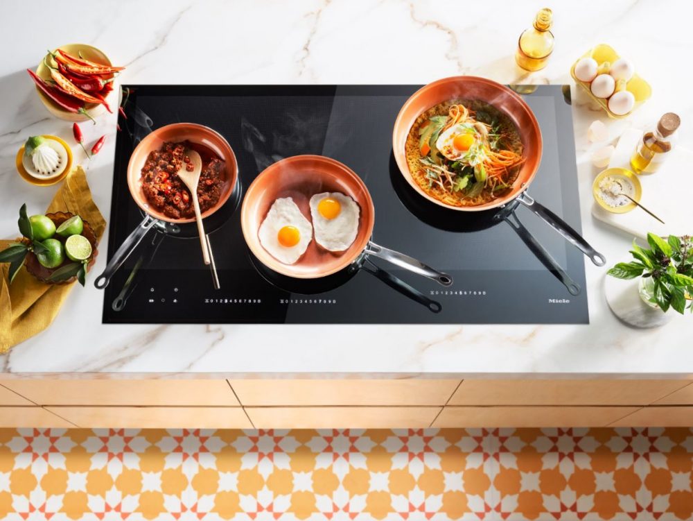 Miele Induction Cooktop with Turmeric and Coconut Pancake being cooked on it.