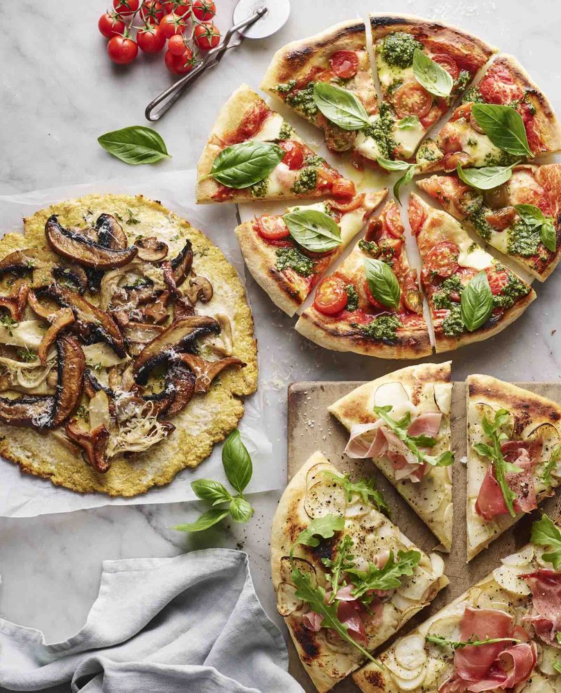 Three pizzas with cauliflower bases.