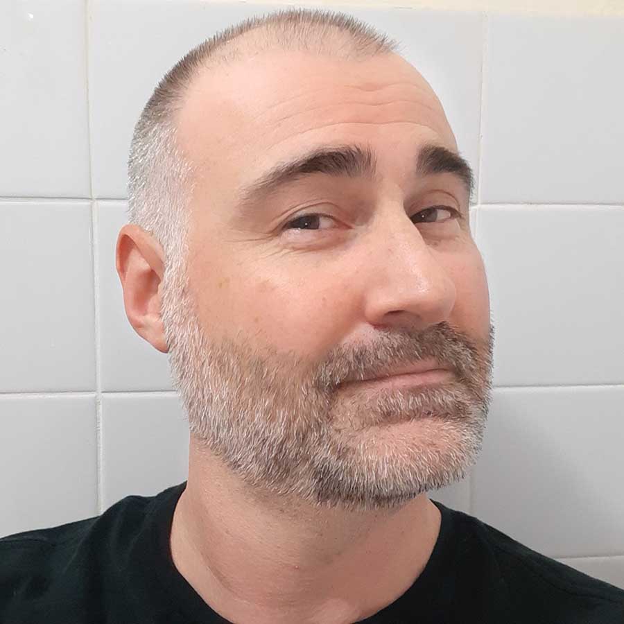 Our Philips Series 9000 Reviewer before shaving his face.