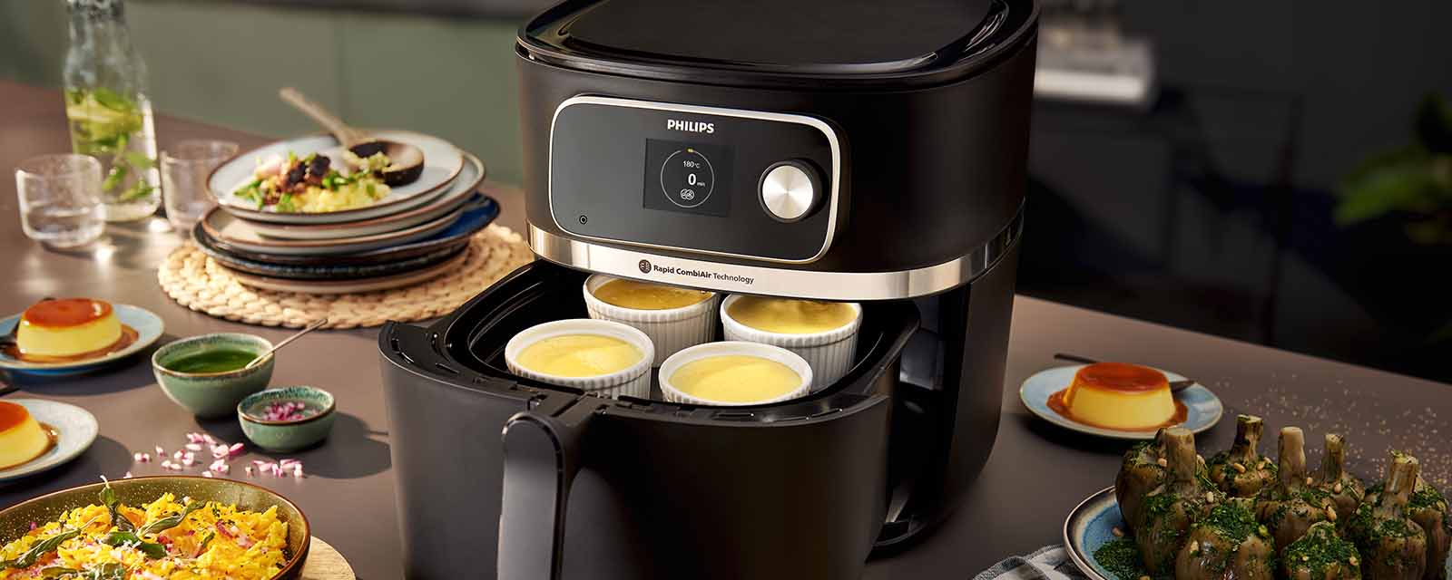 A whole feast of food that has been cooked in the Philips 7000 XXXL Airfryer.
