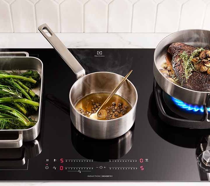 Westholme wagyu bavette cooking on an Electrolux Induction Cooktop with Gas Burner.