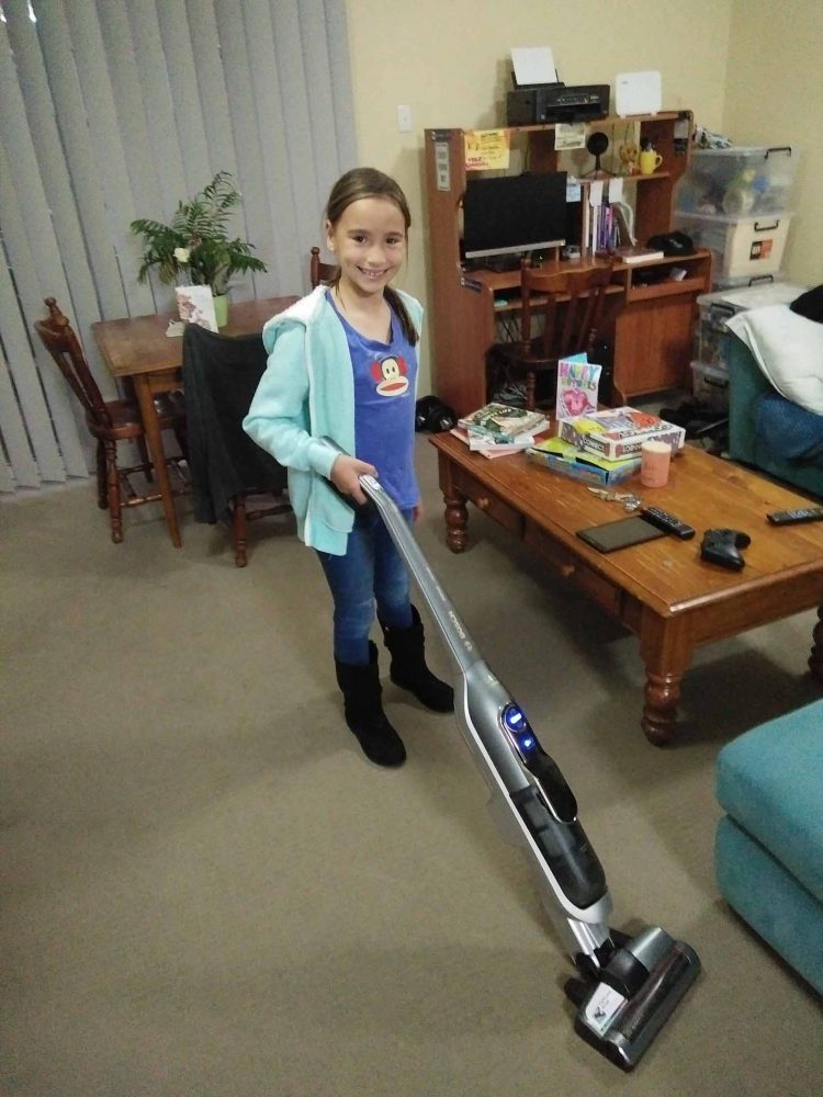 Our writer's daughter vacuuming with the Bosch Athlet Ultimate Vacuum Cleaner.