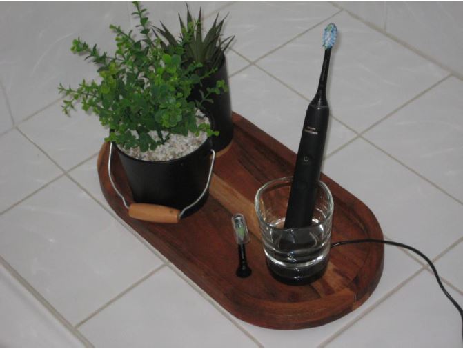 Charging the Philips Sonicare DiamondClean 9000 electric toothbrush.