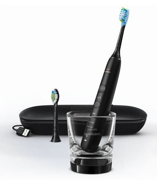 The Philips Sonicare DiamondClean 9000 electric toothbrush pictured with included accessories.